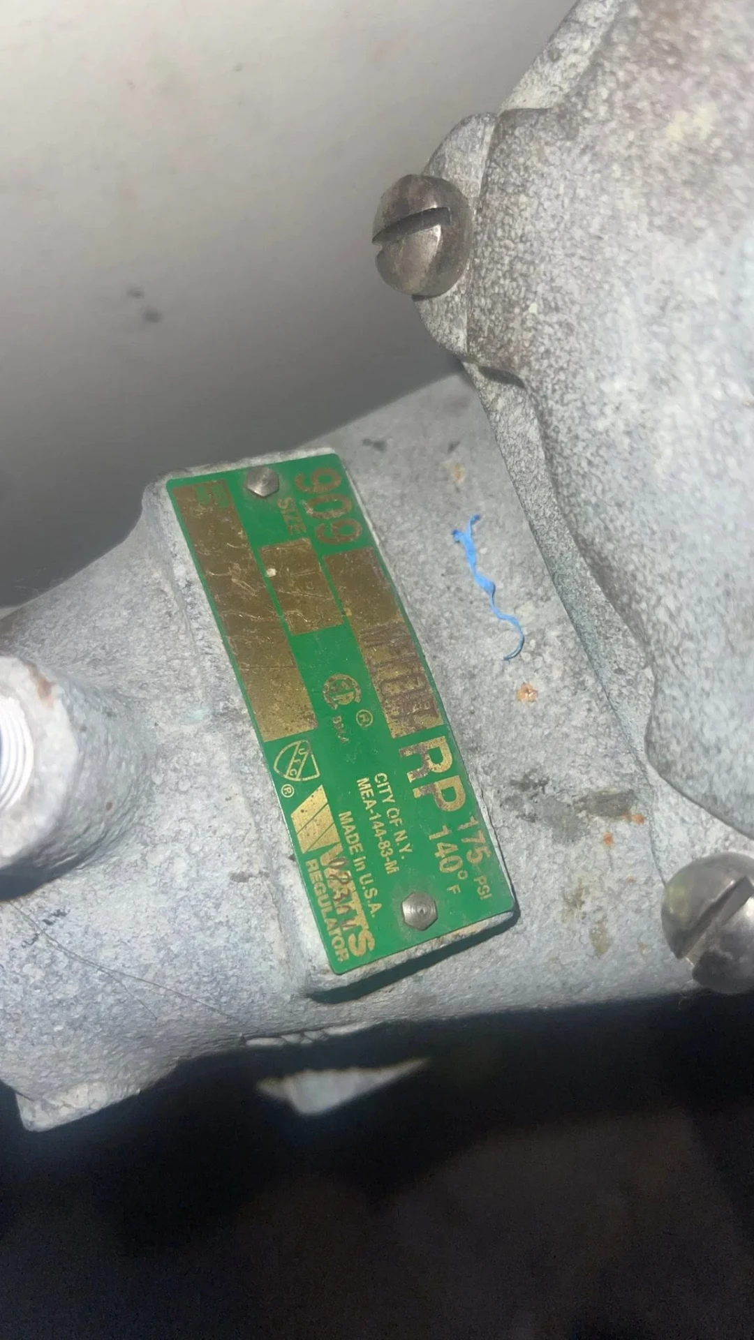 Green Watts 909 reduced pressure zone backflow assembly nameplate showing size and pressure rating