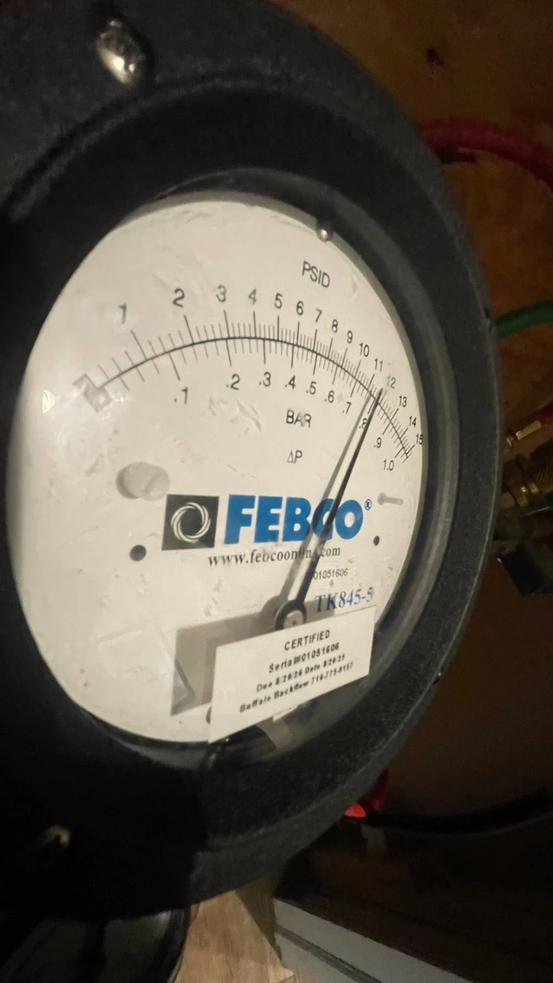 Febco TK845 differential pressure test gauge showing a PSID reading during a backflow test